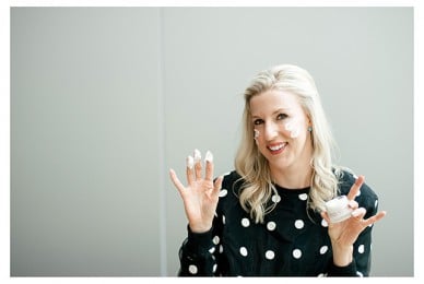 Renee Rouleau with cream on her hands and face