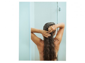 a woman standing in the shower