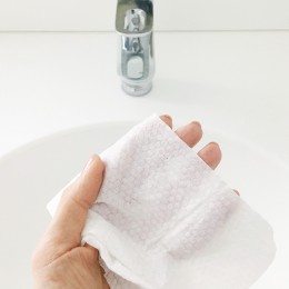 cleansing wipes in front of a sink