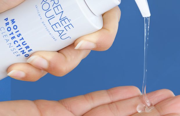 clear, gel face cleanser being pumped into hand