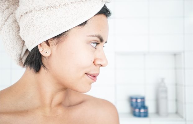 Woman in shower back and body acne