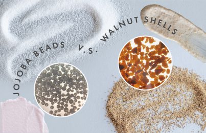 Close-up of round jojoba beads vs. sharp walnut shells