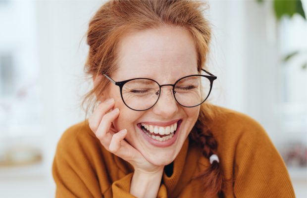 woman smiling wearing prescription eyeglasses