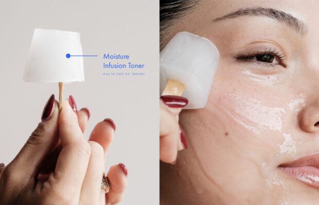 woman using an ice cube on a stick on her skin to reduce her puffy skin